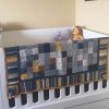 Little Lemon Blanket hung over cot