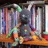 Thackery Earwicket - the mad March Hare, sitting on a bookcase