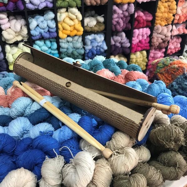 Knitting Needle Case with needles open on yarn