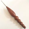 Steel crochet hook with wooden handle.