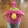 Pink crochet bird egg cosy